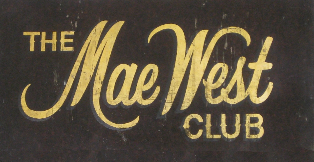 Old nightclub sign reading The Mae West Club